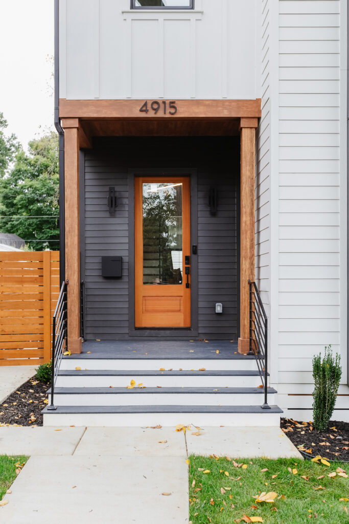 modern farmhouse front door with covered stoop